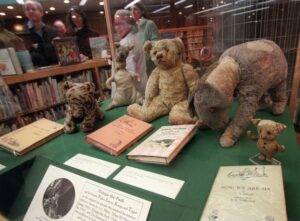 The tattered and faded stuffed animals--Pooh, Tigger, Kanga, Eeyore and Piglet--that inspired the children's tales of A.A. Milne sit in a glass case at a branch of the New York Public Library in New York, Thursday, February 5, 1998. New York Mayor Rudolph Giuliani paid a visit to the animals Thurday to show his support for keeping them in the city.(AP Photo/Bebeto Matthews)