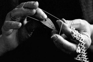 emma2--Emma Everson uses a shuttle made in the late 1880s to tat a method of tying lace patterns by hand.